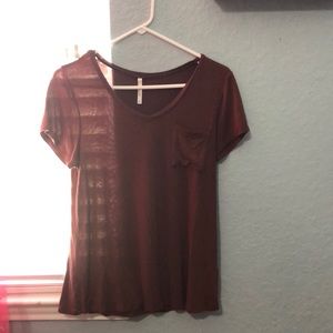 marroon t-shirt with pocket on left of the chest